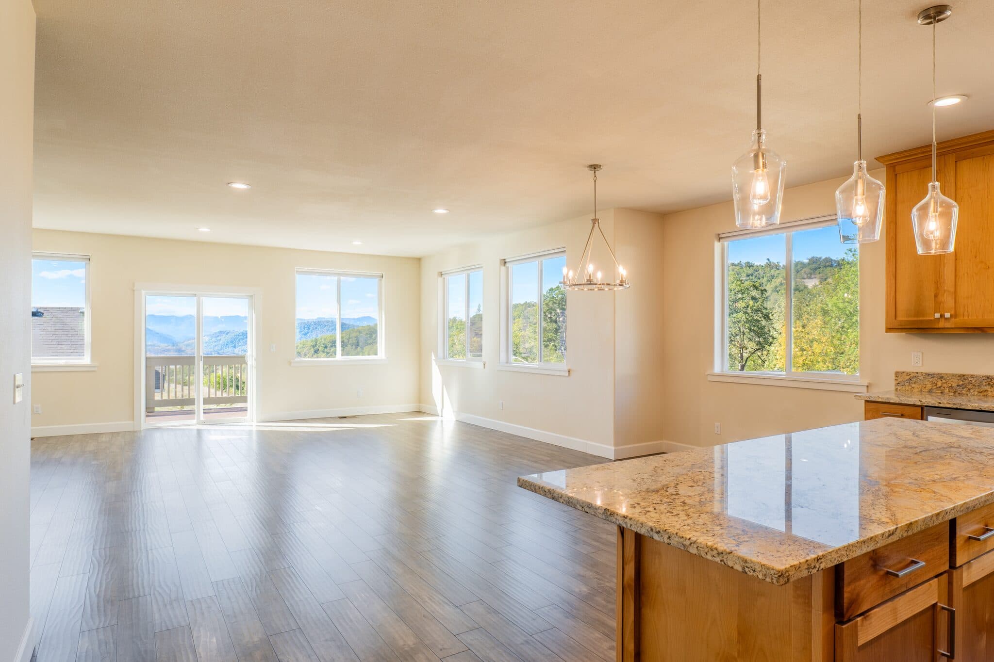 Open kitchen and living space with valley views — real estate photography by Hahn Media, Oregon